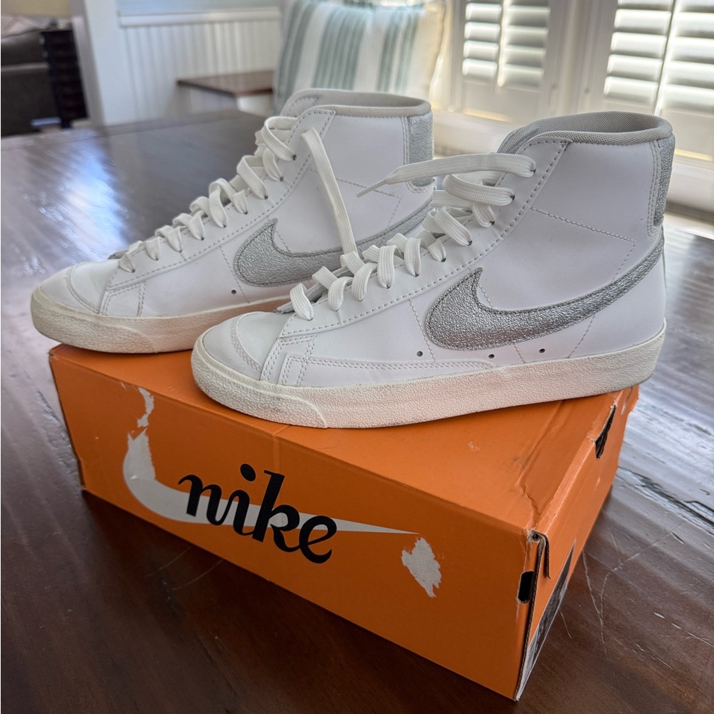 Nike White High-Top Sneakers with Silver Swoosh